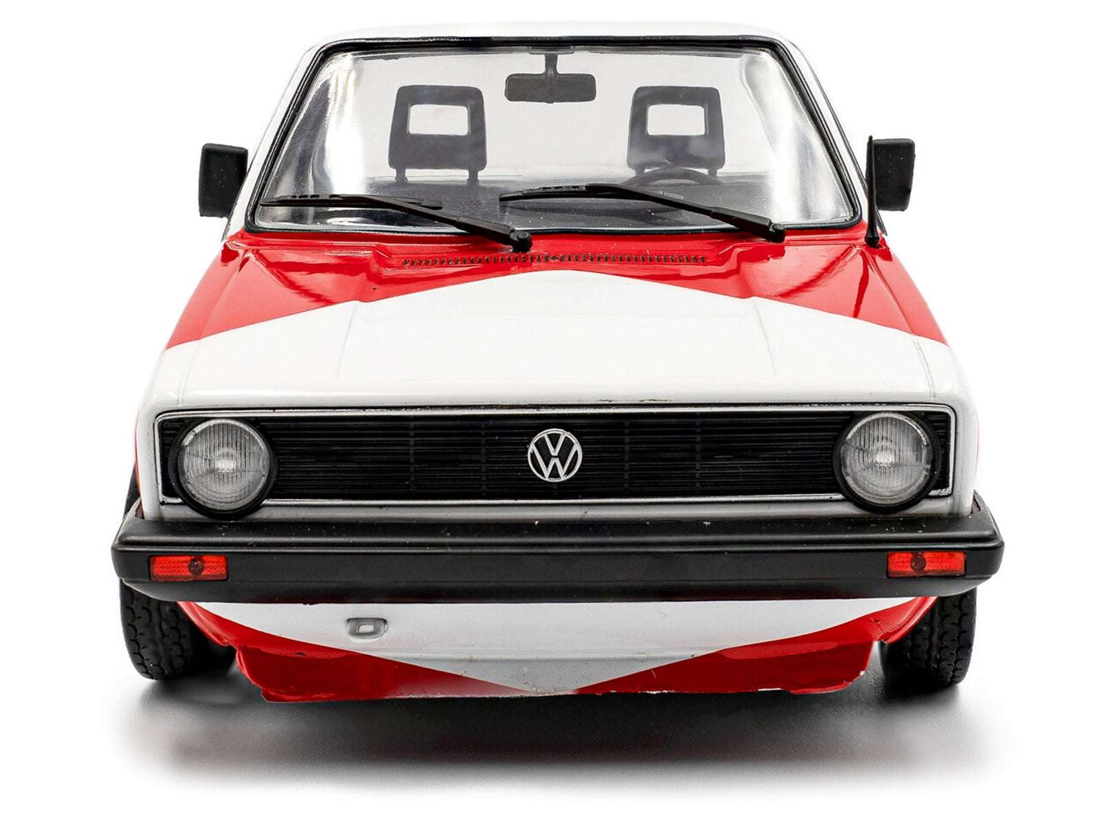 Front view of red and white VW diecast pickup truck model, black grille