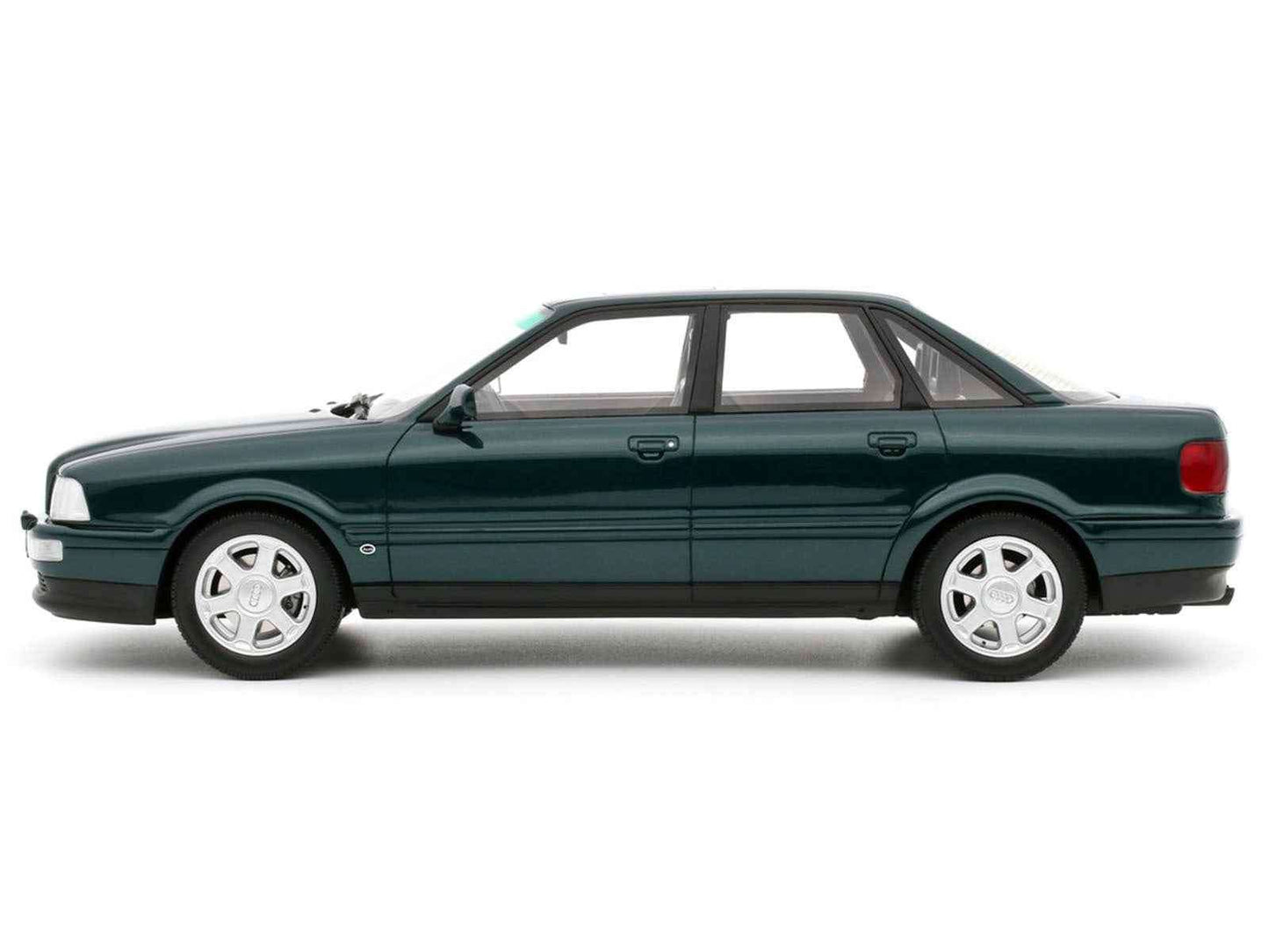 1993 Audi S2 sedan model car, emerald green metallic, side profile, white-spoke wheels