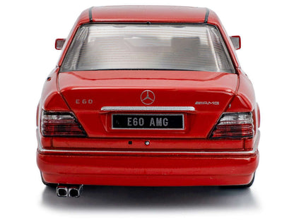Red diecast E60 AMG sedan model car, rear view with E60 AMG badge and exhaust tips