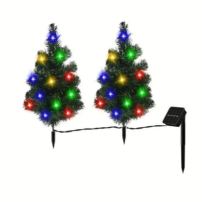 Pair of miniature Christmas tree lawn lights with colorful LED bulbs and ground stakes