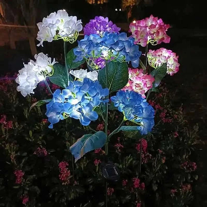 Solar LED hydrangea garden lights with multi-color blooms: white, purple, pink, and blue.