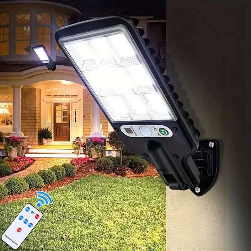 Solar outdoor security street light with bright LED panel mounted on a wall