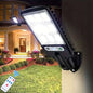 Solar outdoor security street light with bright LED panel mounted on a wall