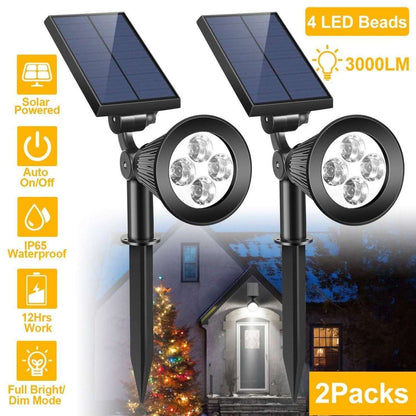 Solar-powered outdoor spotlight set, two black round LED heads with solar panels