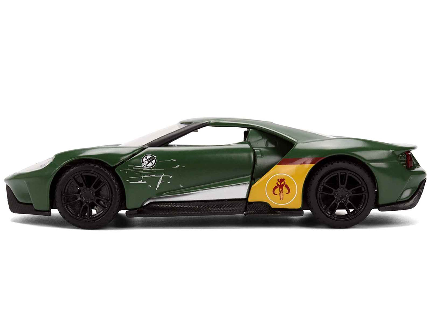 Green diecast Ford GT model car, side profile with red stripe and yellow circular emblem