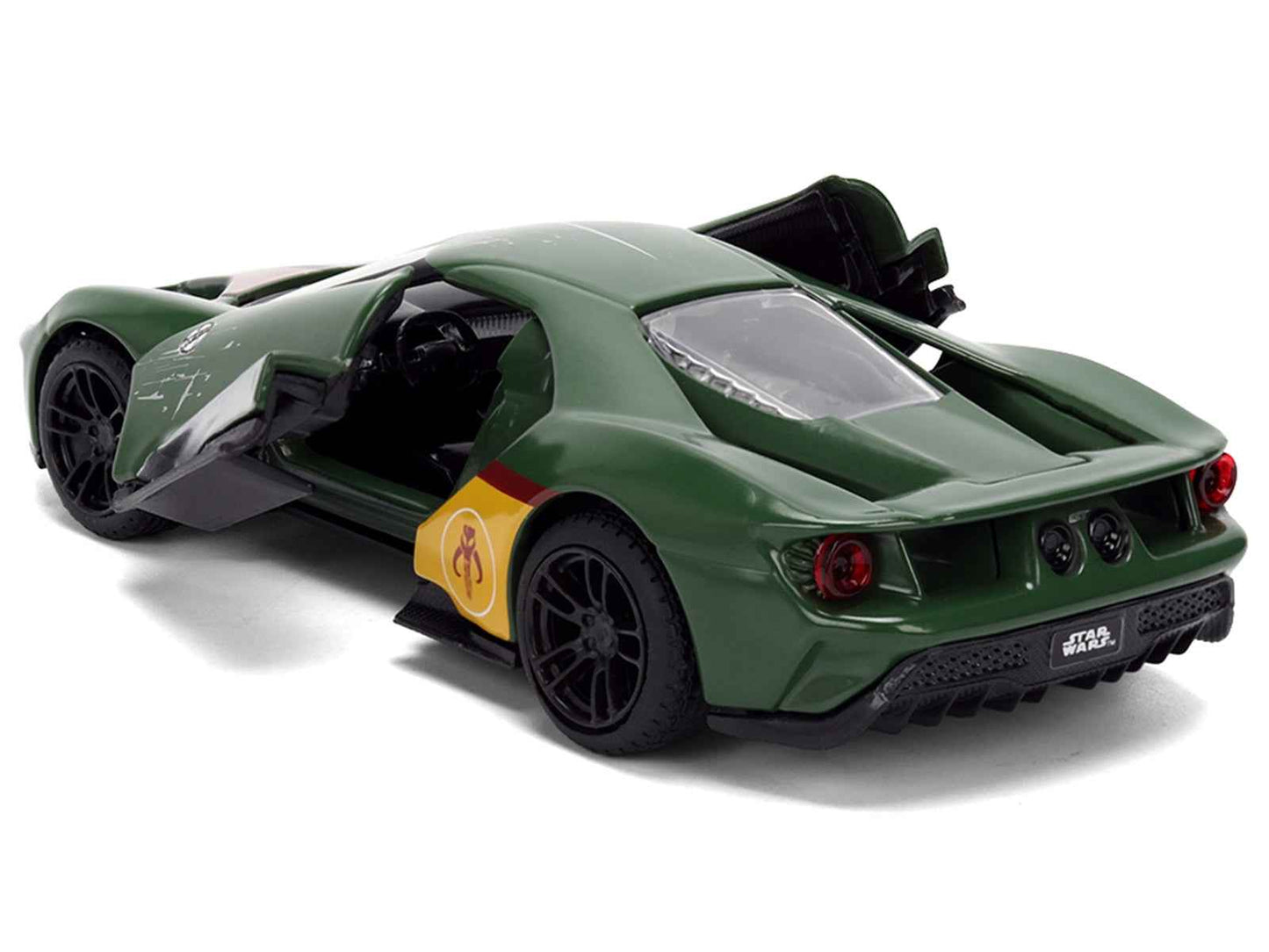 Green diecast Ford GT model car, rear 3/4 view with yellow emblem and black wheels