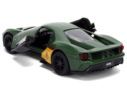 Green diecast Ford GT model car, rear 3/4 view with yellow emblem and black wheels