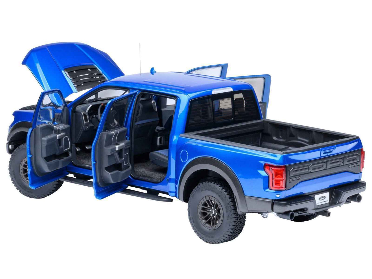 Autoart 1/18 blue Ford F-150 Raptor model truck with doors open, interior visible