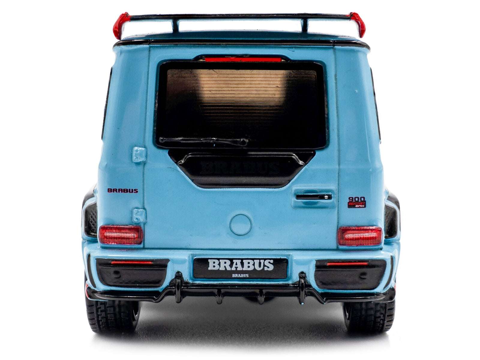 Rear view of light blue diecast SUV model car with Brabus plate and dual exhaust