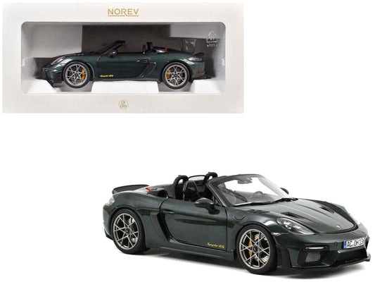 Forest green diecast sports car model with carbon hood stripes, front 3/4 view.