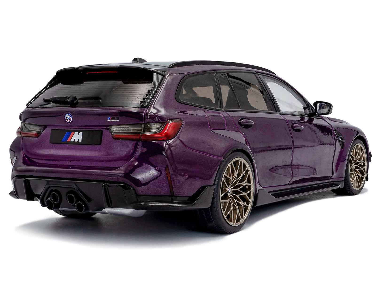 Purple BMW M3 Competition touring diecast model car, rear 3/4 view with M badge