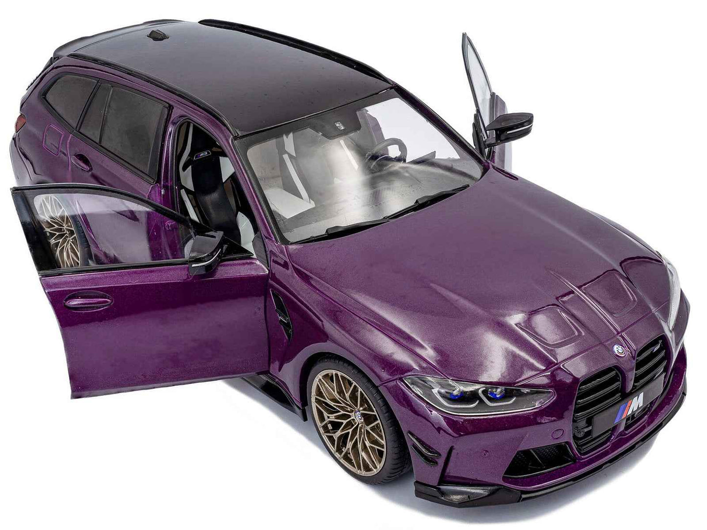 Purple BMW M3 Competition touring diecast model car with open driver door, front-left view