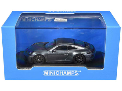 Metallic gray 1/64 diecast sports car model in blue MINICHAMPS display box