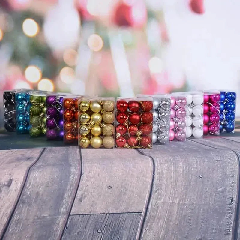 Sparkling Christmas ball ornament set, assorted colored baubles in rows on display tray