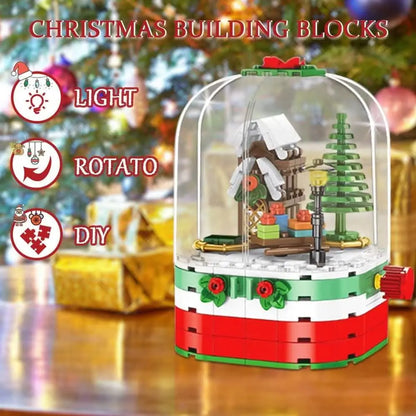 Rotating Christmas building blocks set in a clear dome with house, tree, and base