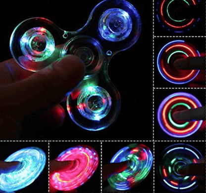 Blue LED fidget spinner with finger near the center and rainbow glow