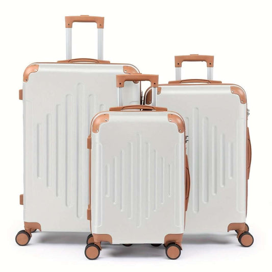 3-piece hard shell luggage set in white with copper trim and spinner wheels