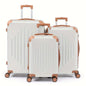 3-piece hard shell luggage set in white with copper trim and spinner wheels