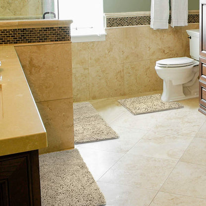 Beige 3-piece chenille bathroom rug set on floor, including bath mat and toilet mat