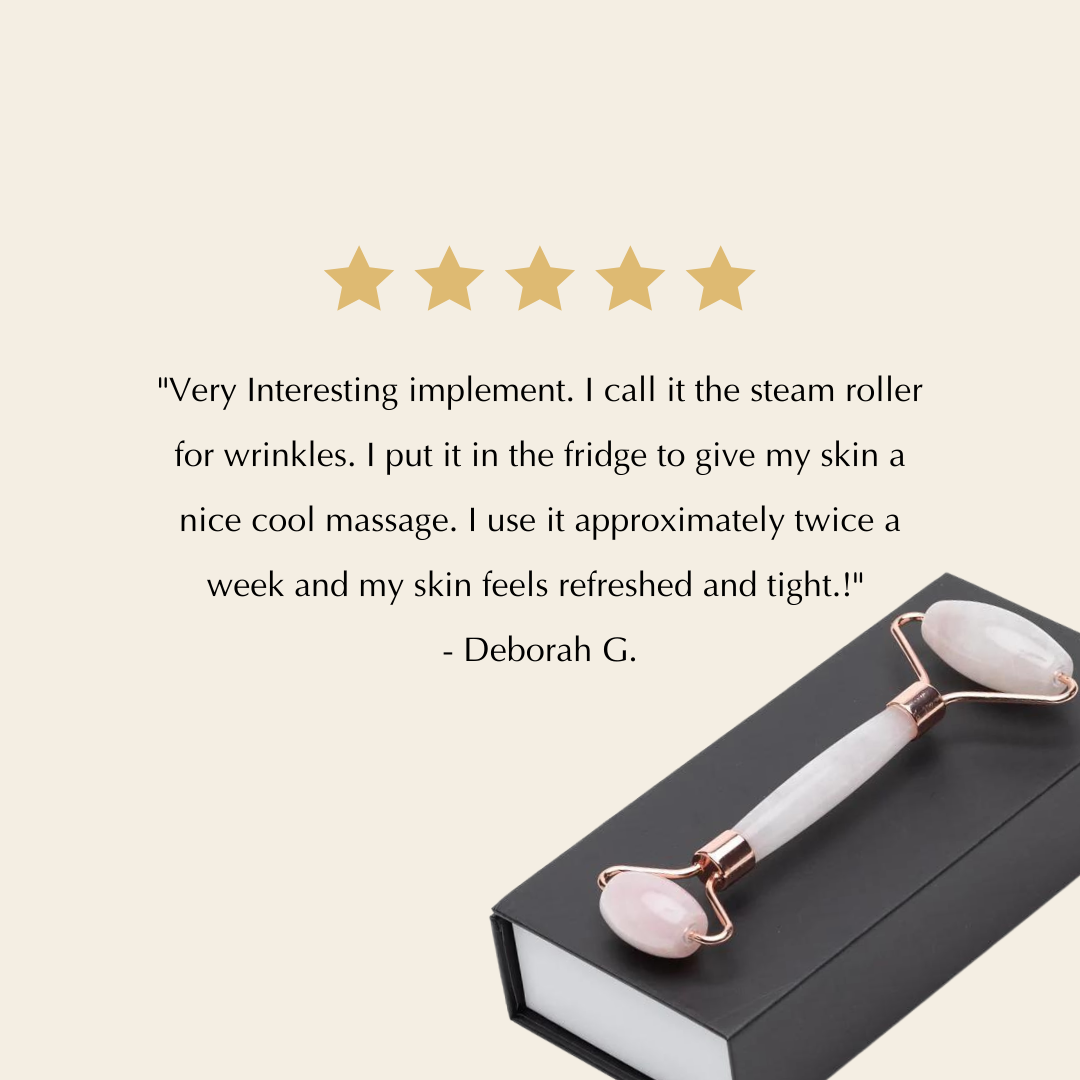 Dual-ended facial roller with pink quartz heads and rose-gold frames, on box