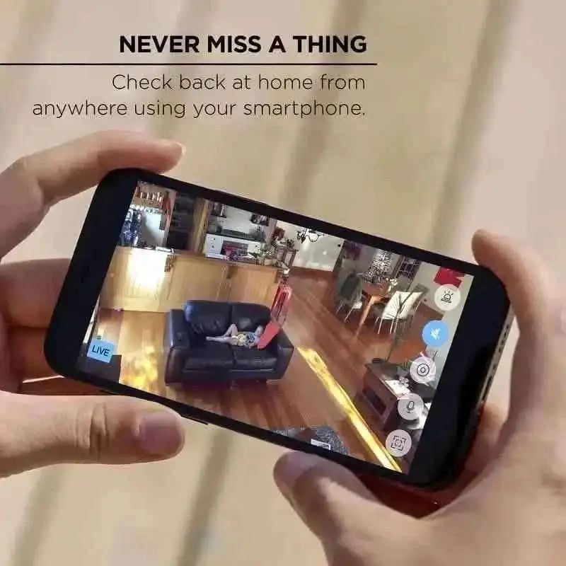 Smartphone held displaying live view from indoor security camera