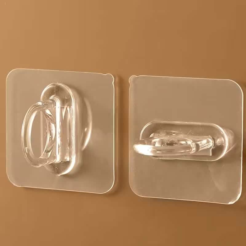 Two clear adhesive hooks with chrome loop holders on transparent wall plates