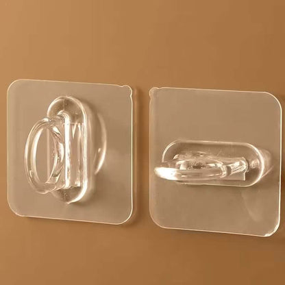 Two clear adhesive hooks with chrome loop holders on transparent wall plates