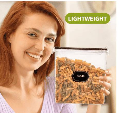 Clear airtight cereal storage container held by a person