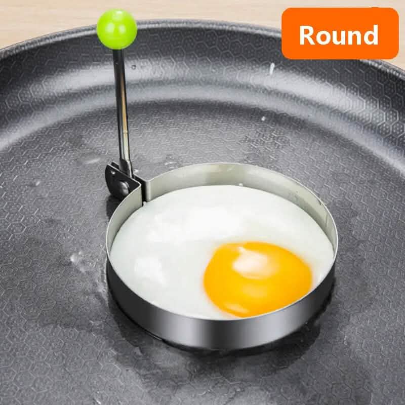 Round egg ring mold with handle, holding a sunny-side egg