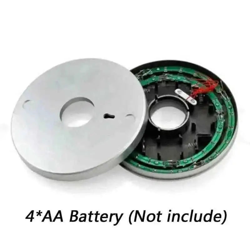 LED umbrella pole light disc with open battery compartment and green circuit board inside
