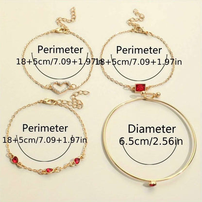 Gold-tone bracelet set with red and clear rhinestone heart and square charms laid out.