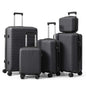 Gray hard-shell spinner luggage set with telescoping handles, 5 suitcase sizes