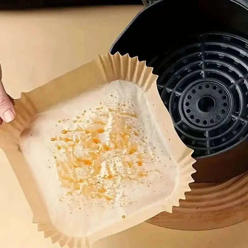 Disposable paper air fryer liner with fluted ribbed sides, lightly seasoned inside