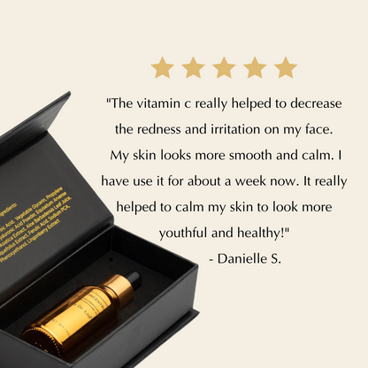 Serum bottle in open black box with gold-toned dropper and protective insert