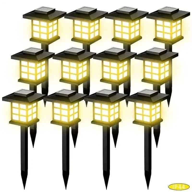 6-pack solar path lights with black stakes and warm LED square lantern housings