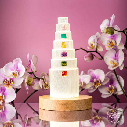 Glowing healing crystal lamp with stacked tiers and multicolor crystal insets on wood base