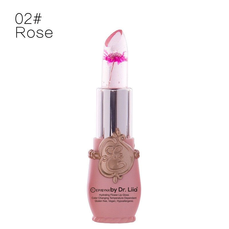 Flower lip gloss in rose-pink tube with translucent cone tip and magenta flower detail
