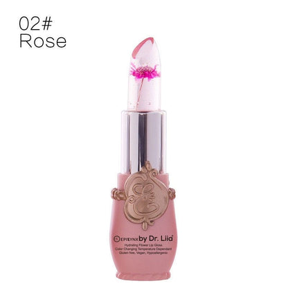Flower lip gloss in rose-pink tube with translucent cone tip and magenta flower detail
