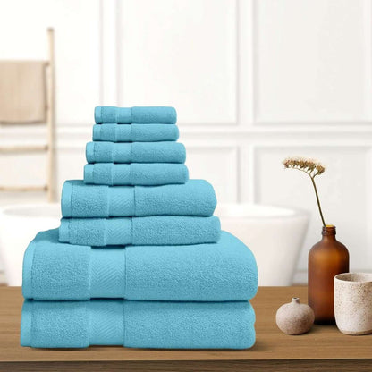 Sky blue bath towel stack with neatly folded terry towels, layered display