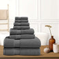 Dark gray bath towel stack with neatly folded terry towels, layered display