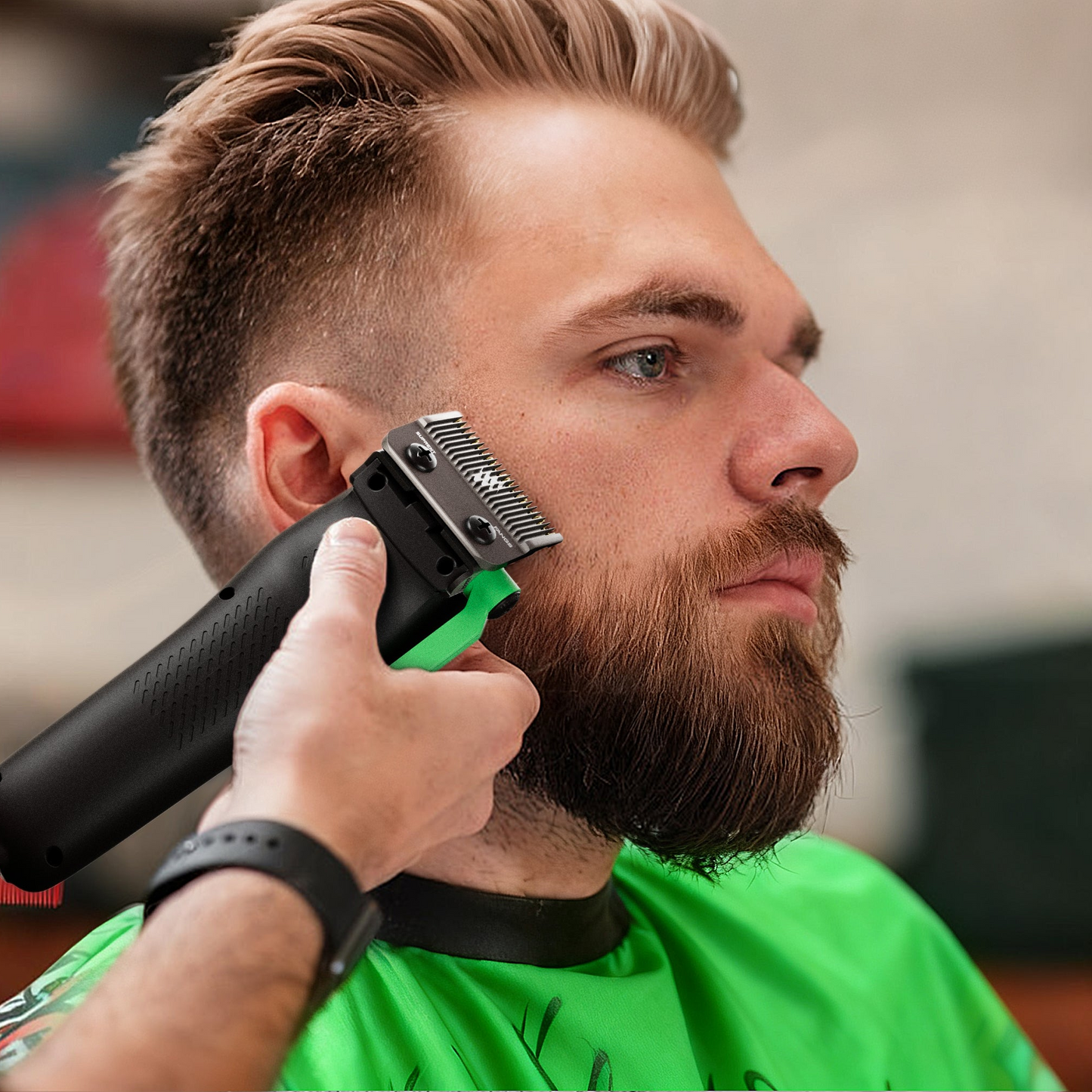Beard trimmer clipping a neckline, black-and-green hair clipper with guard.