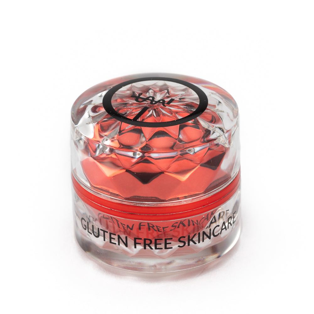 Gluten-free skincare eye cream jar with red gel-like contents