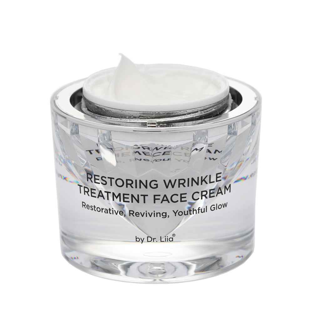 Restoring Wrinkle Treatment face cream in clear glass jar with white cream inside