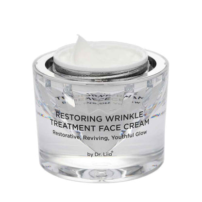 Restoring Wrinkle Treatment face cream in clear glass jar with white cream inside