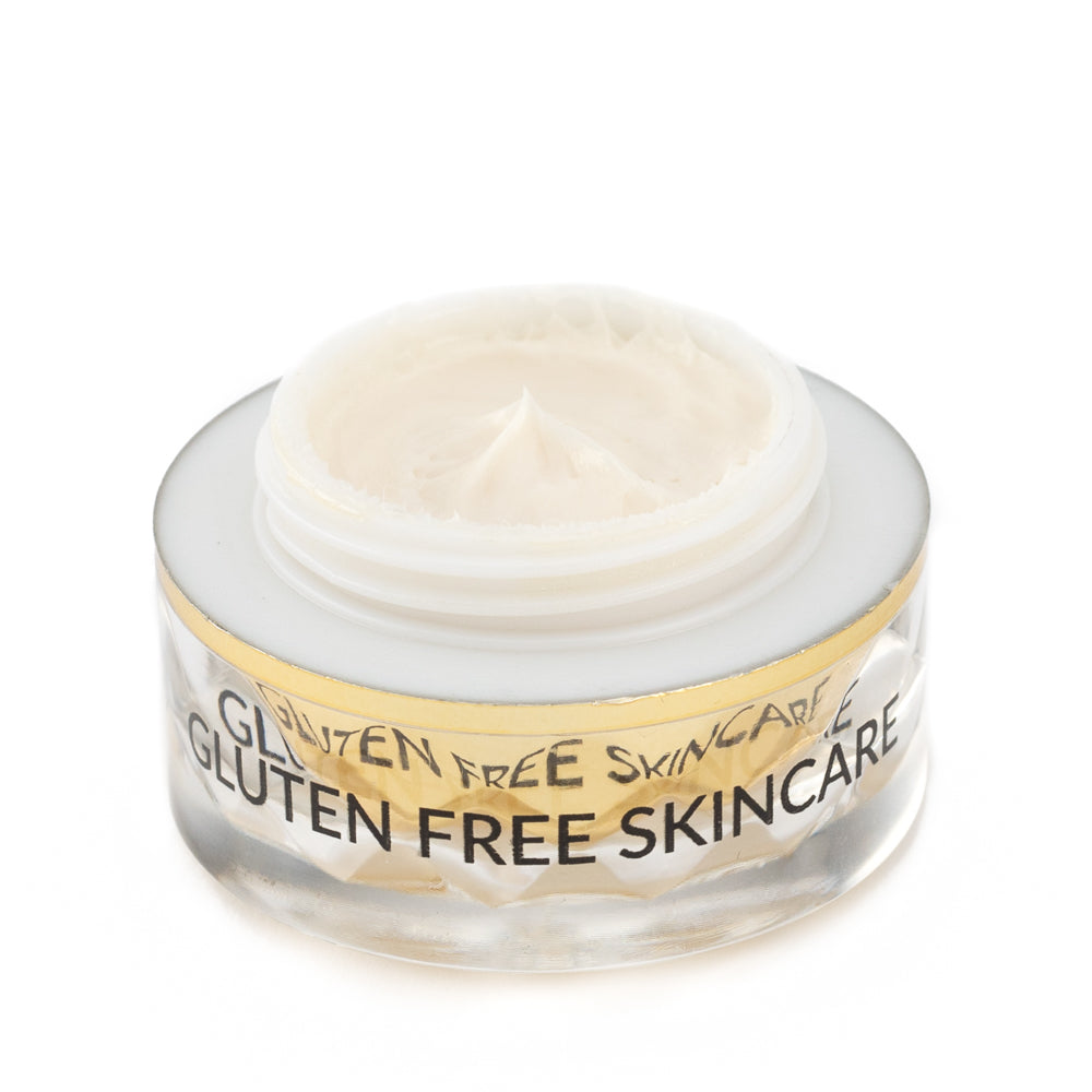 Eye cream jar close-up with pale gel cream inside clear top