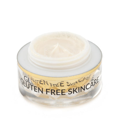 Eye cream jar close-up with pale gel cream inside clear top
