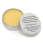 Open balm tin with yellow moisturizing balm inside and silver metal lid