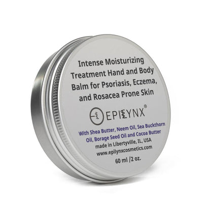 Closed balm tin with front label for intense moisturizing hand and body balm