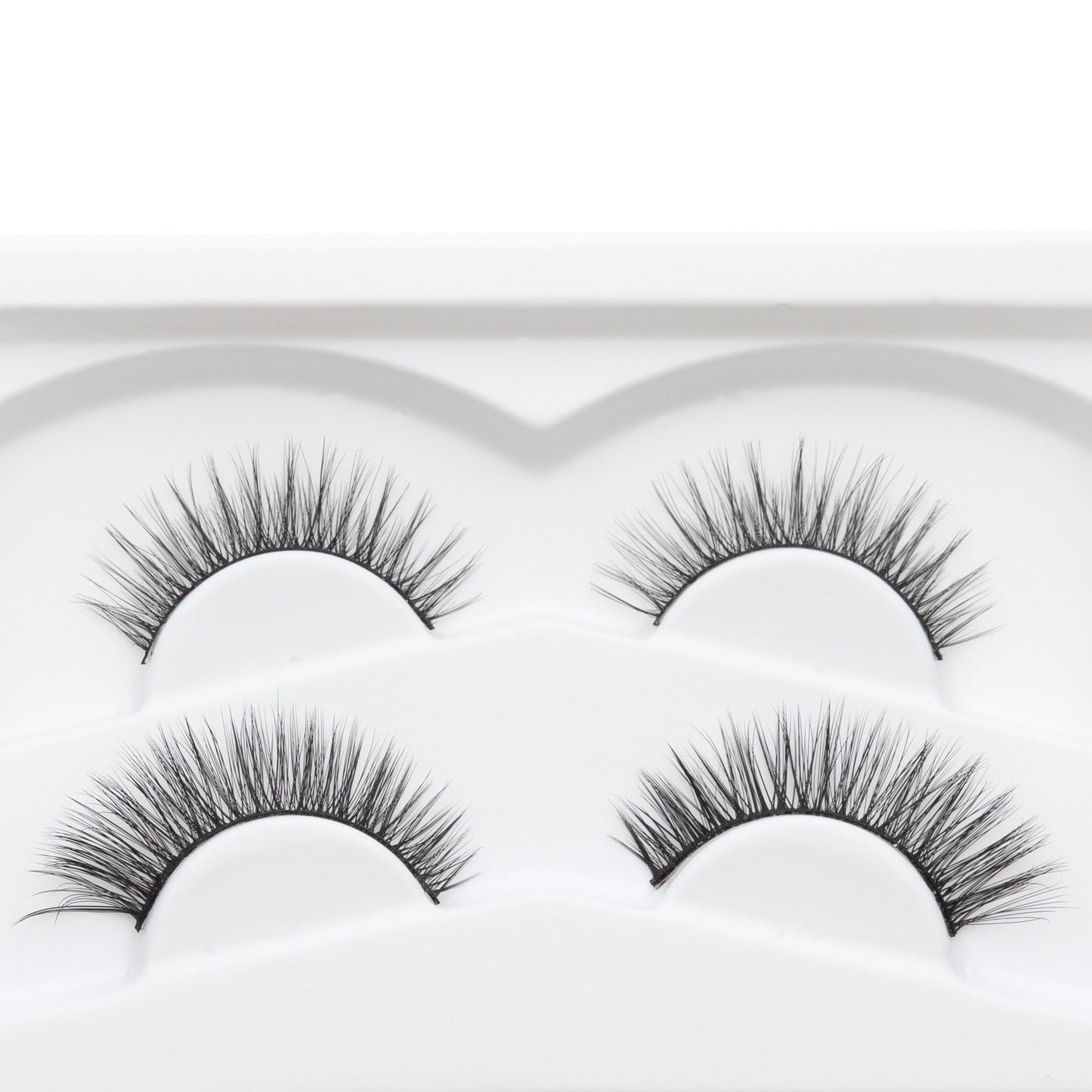 Reusable false eyelash strips, four curved bands with dark fibers