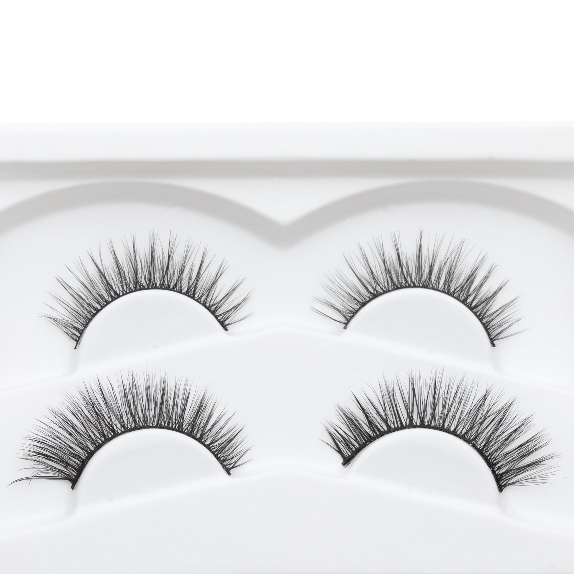 Reusable false eyelash strips, four curved bands with dark fibers